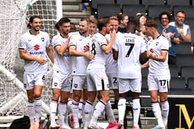 MK Dons celebrate Mo Eisa’s goal against Tranmere Rovers on Saturday