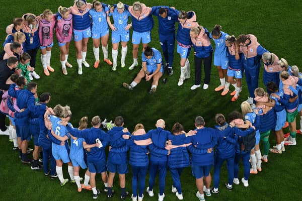 The England side distraught after losing the World Cup final to Spain in Sydney on Sunday. Pic: Getty