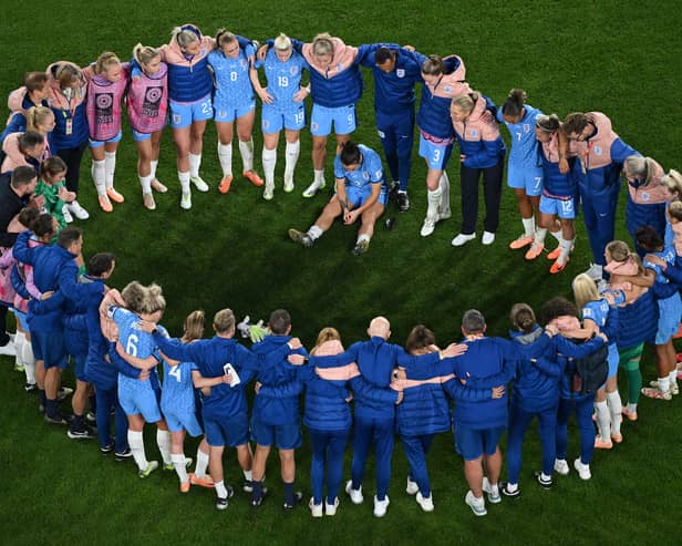 The England side distraught after losing the World Cup final to Spain in Sydney on Sunday. Pic: Getty