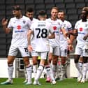 MK Dons celebrate Warren O’Hora’s second goal at Stadium MK