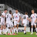 MK Dons celebrate after scoring their third against Chelsea U21s on Tuesday night Pic: Jane Russell