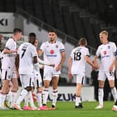 MK Dons celebrate after scoring their third against Chelsea U21s on Tuesday night Pic: Jane Russell