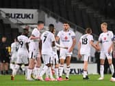 MK Dons celebrate after scoring their third against Chelsea U21s on Tuesday night Pic: Jane Russell