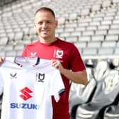 Jack Payne poses with his new MK Dons shirt after completing his loan move from Charlton Athletic