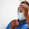 A nurse prepares a dose of a Covid-19 vaccine.