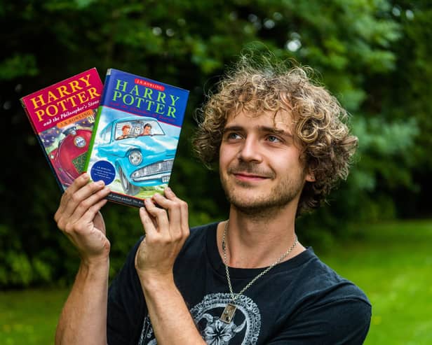 Max Roe with first edition copies of Harry Potter books his mum got him when he was young - one signed by JK Rowling could be worth £10,000.