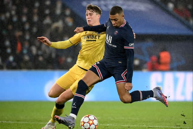 Hendry taking on Kylian Mbappe in Brugge’s 1-1 draw with PSG in the Champions League. Pic: Getty