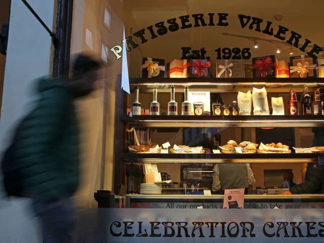 A pedestrian walks past a branch of a Patisserie Valerie cafe in London on January 23, 2019.