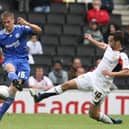 Sam Baldock flies into a tackle against Peterborough’s Ryan Bennett. Pic: Getty