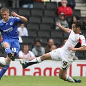 Sam Baldock flies into a tackle against Peterborough’s Ryan Bennett. Pic: Getty