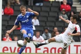 Sam Baldock flies into a tackle against Peterborough’s Ryan Bennett. Pic: Getty