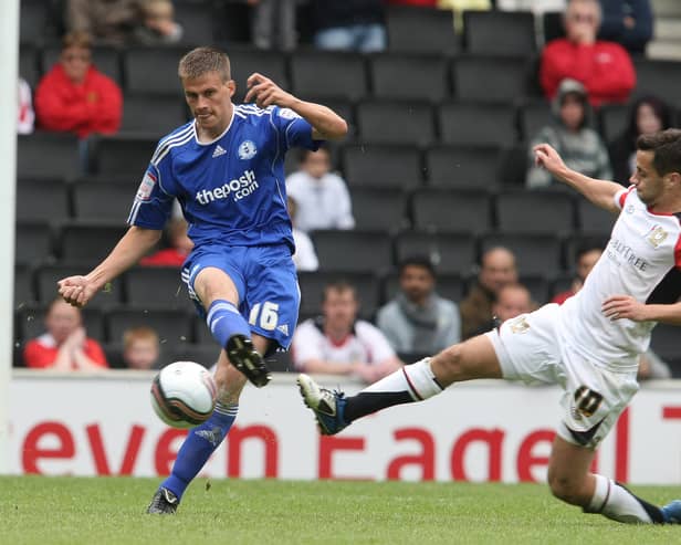 Sam Baldock flies into a tackle against Peterborough’s Ryan Bennett. Pic: Getty
