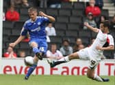 Sam Baldock flies into a tackle against Peterborough’s Ryan Bennett. Pic: Getty