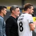 Alex Gilbey with Dons head coach Graham Alexander