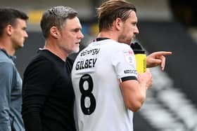 Alex Gilbey with Dons head coach Graham Alexander