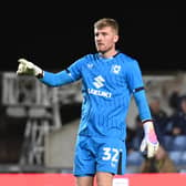 Goalkeeper Michael Kelly will remain a part of the MK Dons fold until at least January after signing a new short-term deal