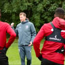 Mike Williamson addresses his players in training