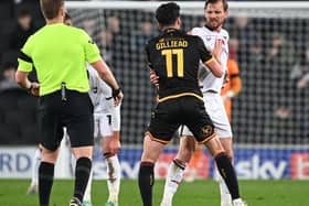 Alex Gilliead takes on Alex Gilbey during Bradford’s defeat to MK Dons on Tuesday