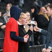 Mike Williamson met some of the MK Dons fans, and posed for pictures, after Saturday’s win over Swindon Town