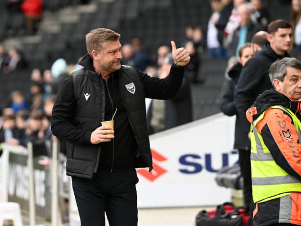 Karl Robinson is linked with the vacant Rotherham manager's job