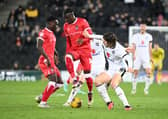 Grimsby Town battle in the midfielder against MK Dons