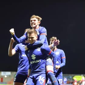 Goalscorers Joe Tomlinson and Max Dean celebrate at Morecambe