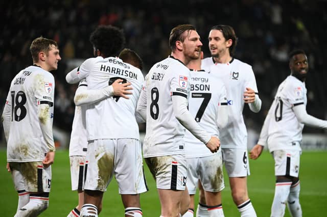 MK Dons celebrate their win over Colchester United on Boxing Day