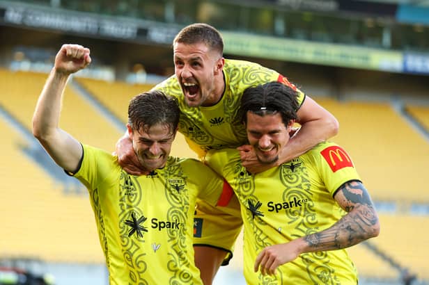 Scott Wootton celebrates with his Wellington team-mates