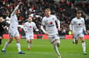 MK Dons celebrate Max Dean's goal against Morecambe on Saturday