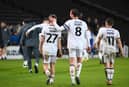 Alex Gilbey congratulates Dan Kemp on his first MK Dons goal