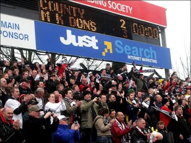 Celebrations at the full-time whistle after MK Dons secured promotion from League Two