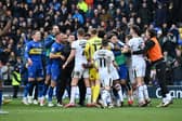 AFC Wimbledon and MK Dons at the full-time whistle at Plough Lane