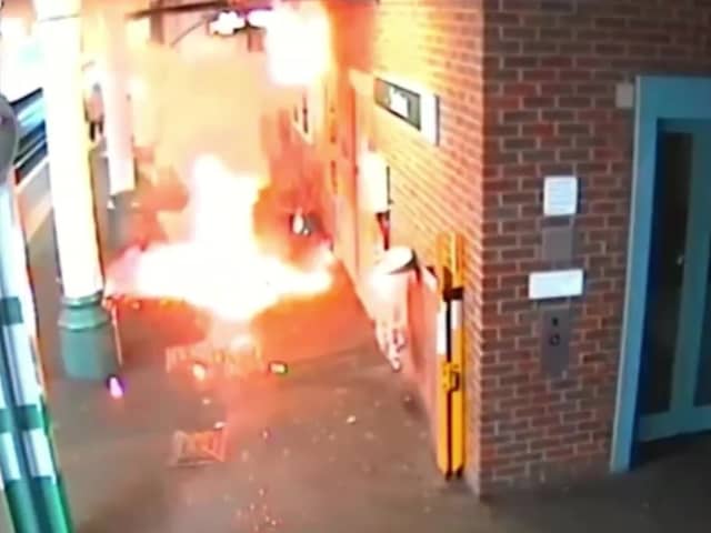 Video grab of the moment an e-bike exploded, causing a "ferocious" fire - as its owner stood waiting for a train. 