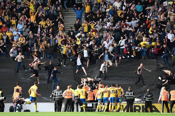 Mansfield celebrate with their travelling support