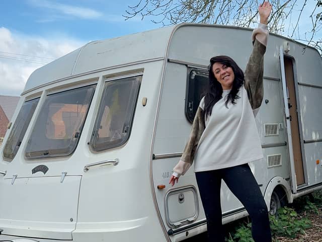 Hayley Rubery in front of her caravan. 