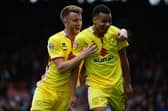 Josh Murphy celebrates scoring against Fulham with MK Dons team-mate Dean Bowditch