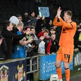 Filip Marschall with MK Dons supporters