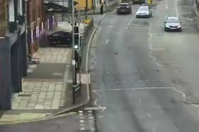 Car crashes through metal barriers and into the front of theatre.