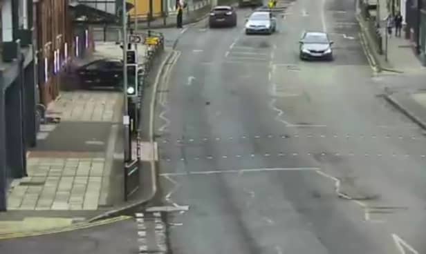 Car crashes through metal barriers and into the front of theatre.