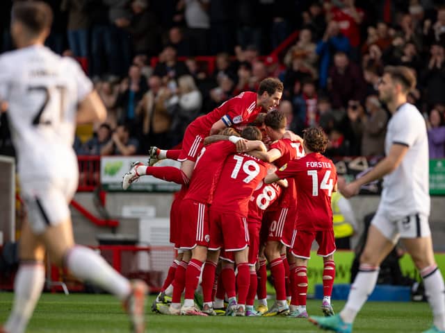 Crawley Town celebrate as they thump MK Dons 3-0 at Broadfield Stadium. Pic: Eva Gilbert