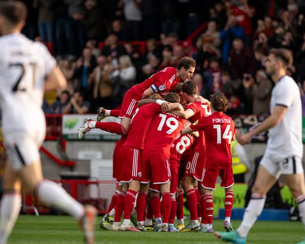 Crawley Town celebrate as they thump MK Dons 3-0 at Broadfield Stadium. Pic: Eva Gilbert