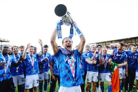 Neill Byrne lists the League Two trophy for Stockport