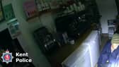 Burglar Stephen Clark found by police hiding under restaurant counter.