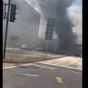 Thick plumes of black smoke covered the area after the car caught fire -Credit:Rick Bache/Facebook