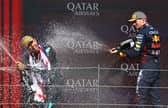 Max Verstappen on the podium with Lewis Hamilton