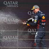 Max Verstappen on the podium with Lewis Hamilton
