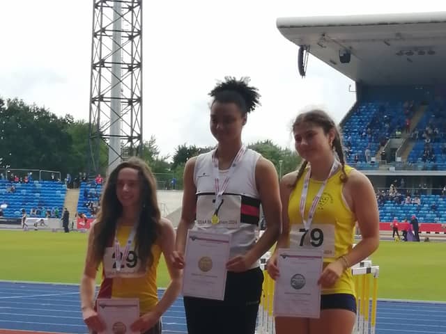 Ayesha Jones atop the podium