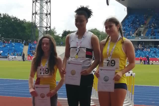 Ayesha Jones atop the podium
