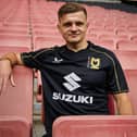 Joe Tomlinson models the new black third strip