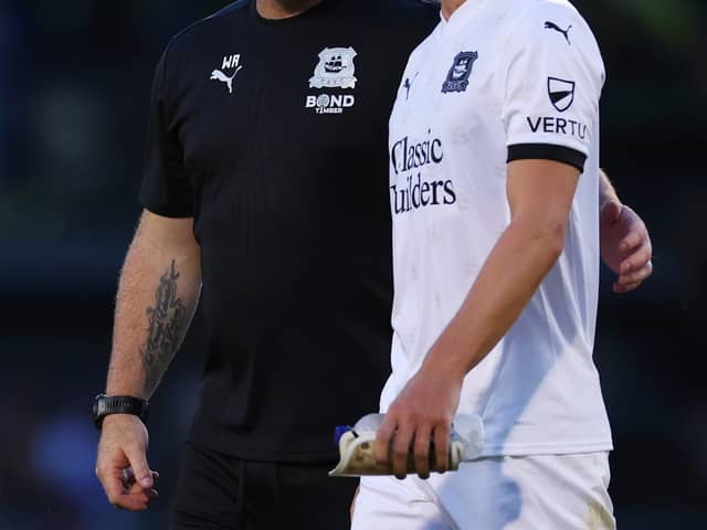 Plymouth boss Wayne Rooney with ex-Dons midfielder Jordan Houghton
